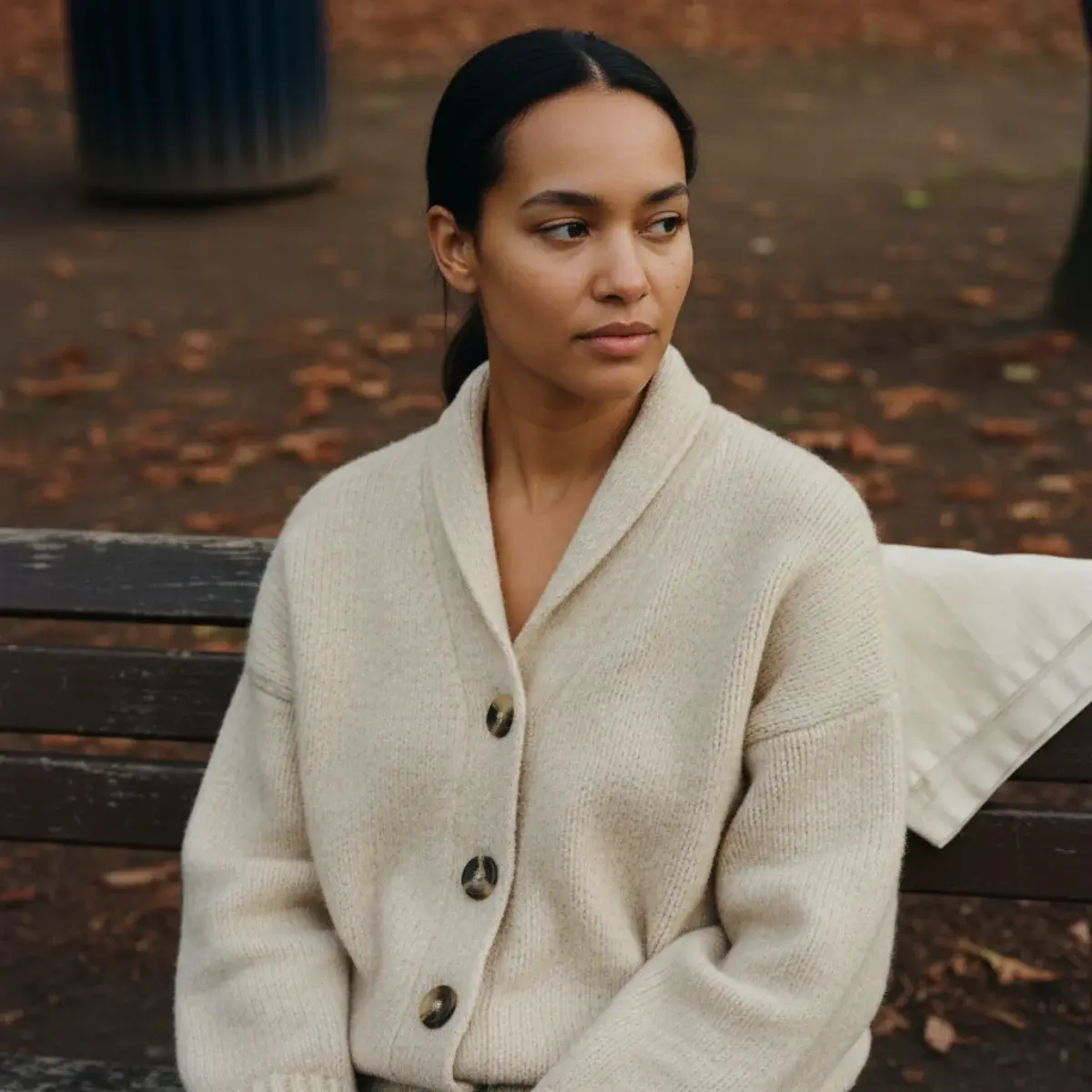 Classic old money fall aesthetic: camel coat, cream roll-neck, tailored trousers, and knee-high riding boots