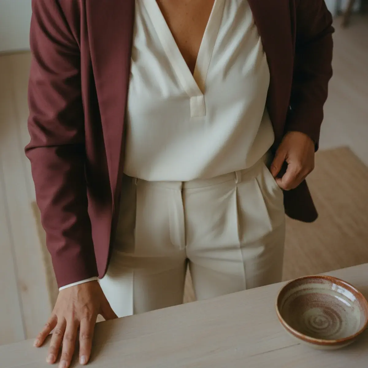 Seasonal interview looks: a lightweight summer blazer and a layered fall roll-neck with a wool coat