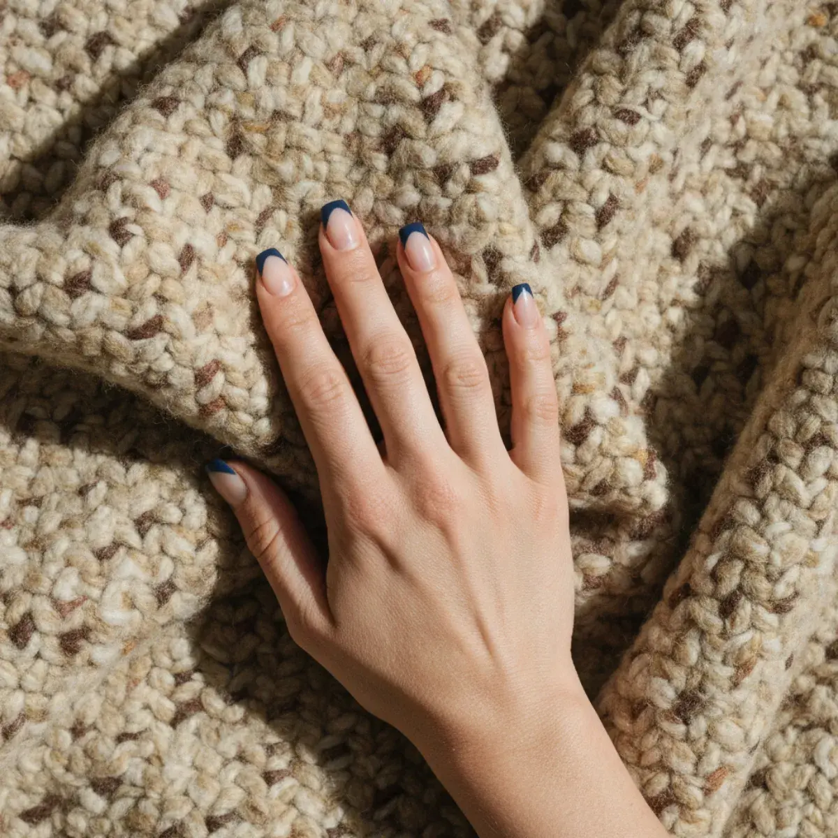 Timeless classic nail looks: a nude, a classic red, a soft pink, a sheer natural finish, and a French manicure