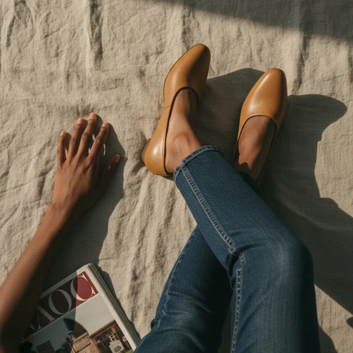 Smart casual with jeans: dark undistressed denim, a silk top, a blazer, and loafers