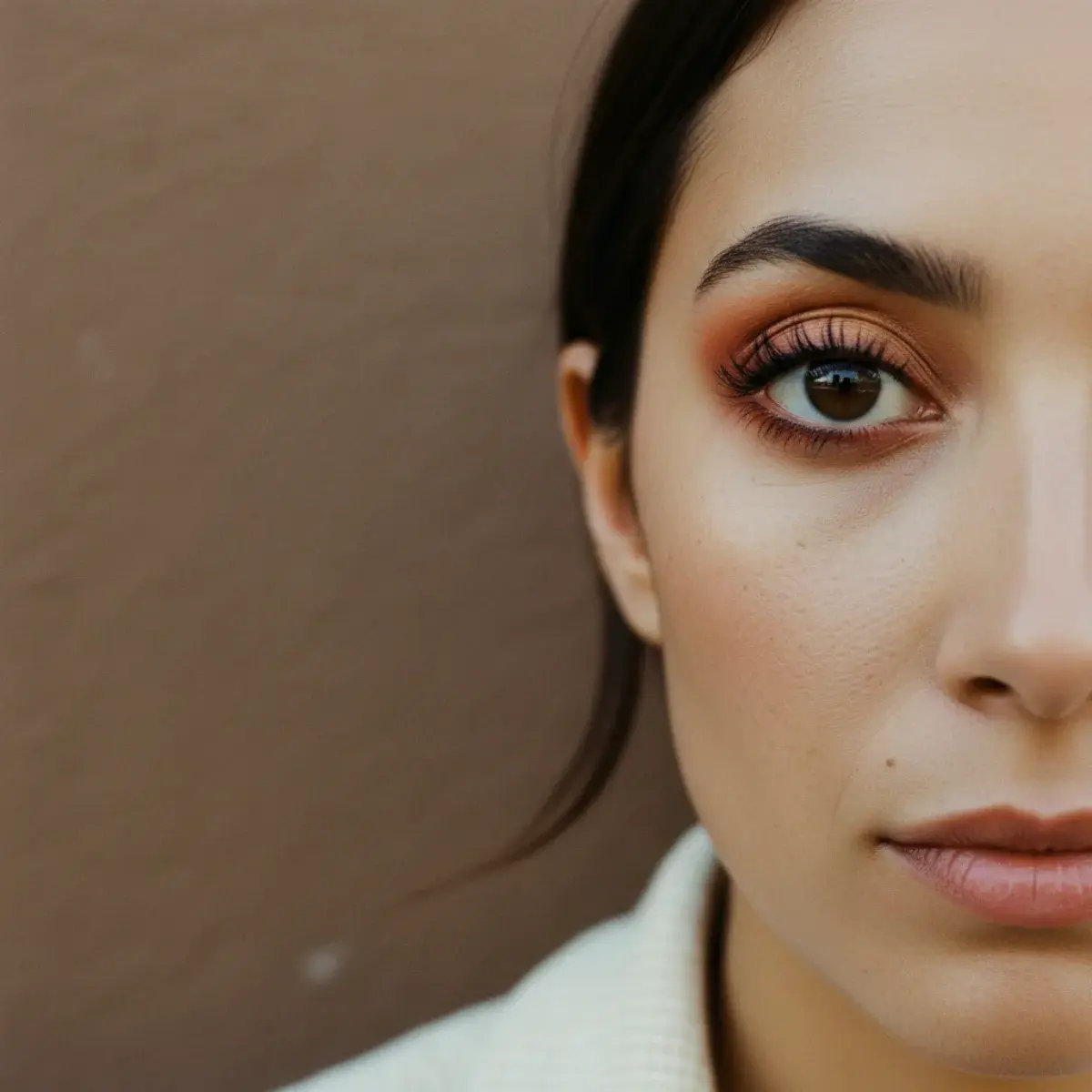A wedding touch-up kit in a clutch: lip product, blotting papers or compact powder, and a small concealer